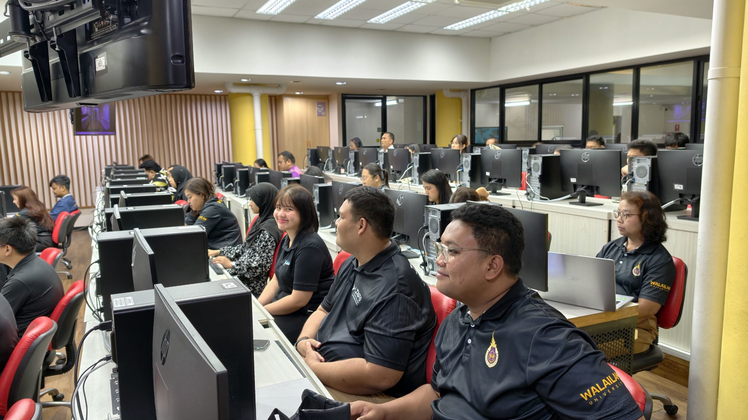 Students participating in a computer lab session at Walailak University.